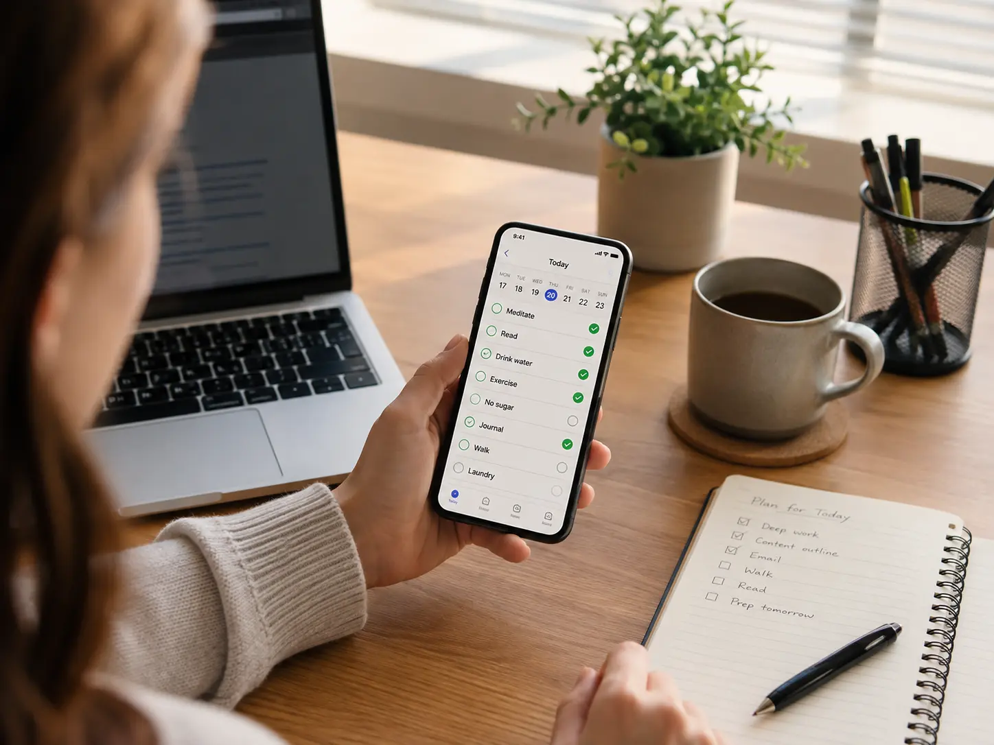 Adult reviewing daily habits in Loop Habit Tracker while planning an ADHD-friendly routine